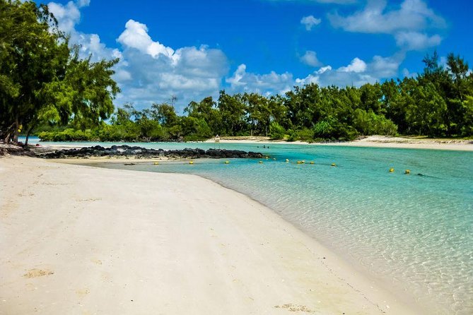 Catamaran to Ile aux Cerf with Parasailing, Tube Riding & Lunch - Parasailing over the lagoon