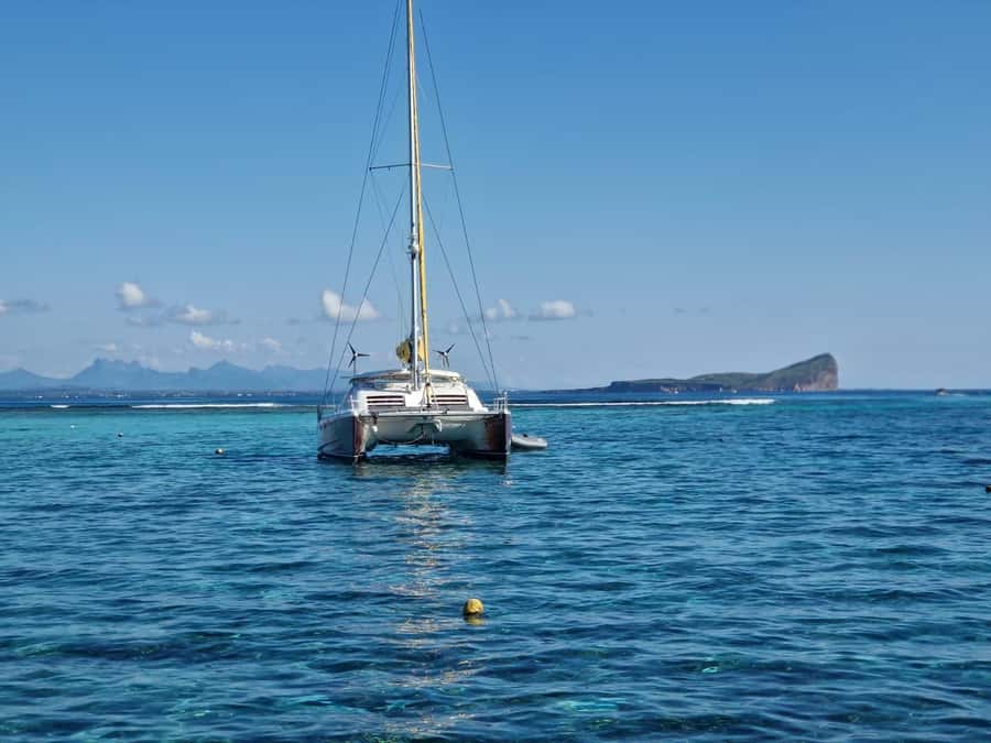 Grand Bay: Catamaran Cruise to Flat Island with BBQ Lunch - Leaving Grand Baie by dinghy and catamaran