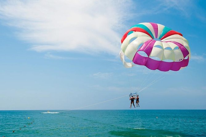 Ile aux Cerf: Speed boat with Parasailing & Tube Riding and Lunch - Parasailing above the lagoon